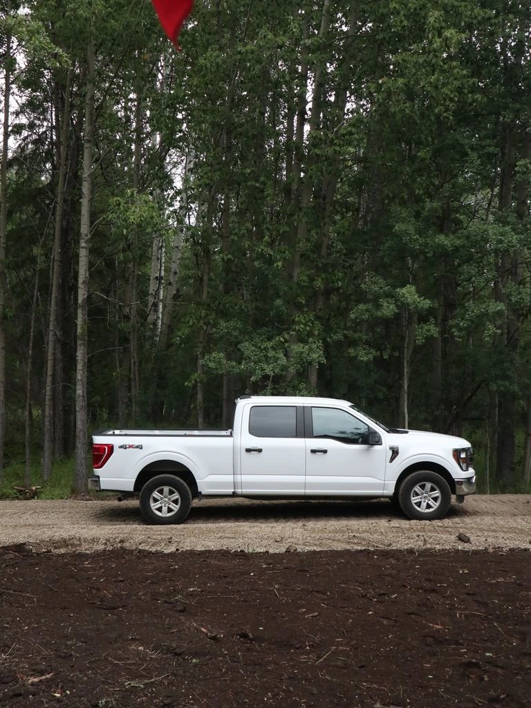 Toyota Tacoma TRD Off-Road climbing a dusty desert track